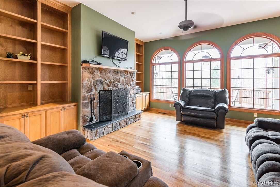 11300 Taylor Road Chesterfield, VA 23838 - Photo 7 of 39 a living room with furniture a fireplace and a flat screen tv