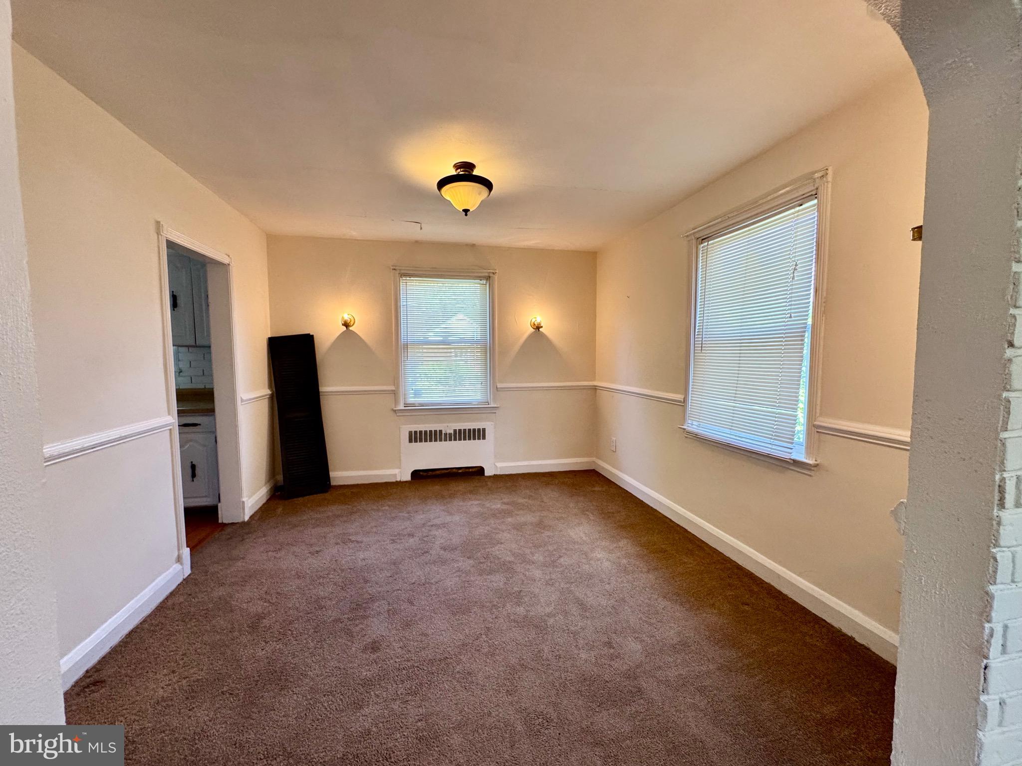 3913 Loch Raven Boulevard Baltimore, MD 21218 - Photo 11 of 38 a view of a room with refrigerator and cabinet