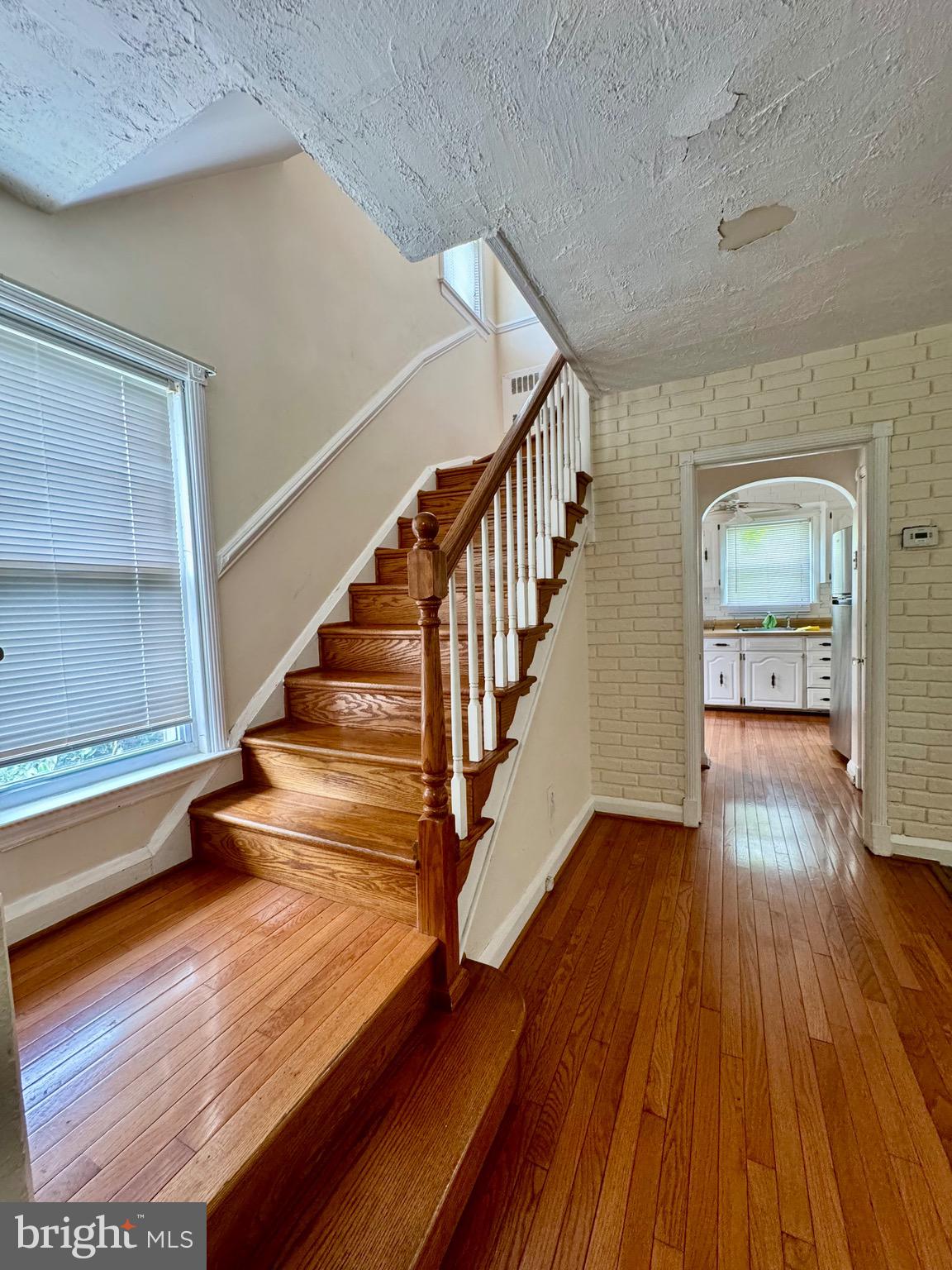 3913 Loch Raven Boulevard Baltimore, MD 21218 - Photo 15 of 38 a view of entryway and hall with wooden floor