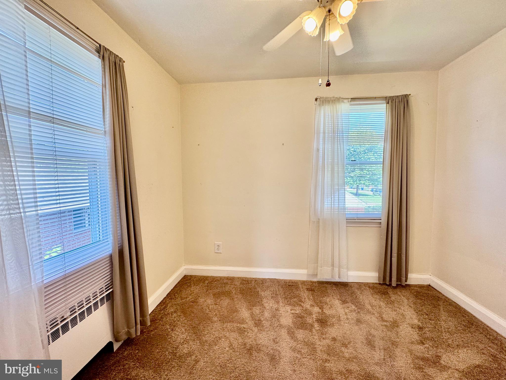 3913 Loch Raven Boulevard Baltimore, MD 21218 - Photo 17 of 38 a view of an empty room with a fireplace