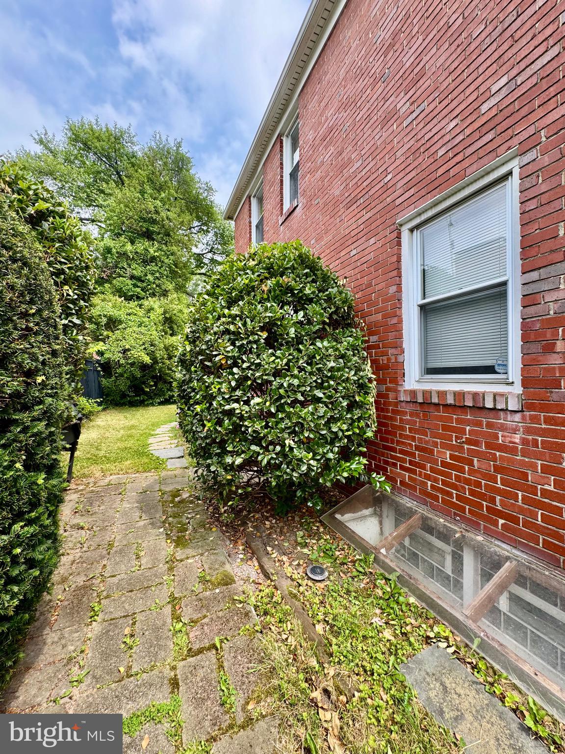 3913 Loch Raven Boulevard Baltimore, MD 21218 - Photo 24 of 38 a front view of a house with a yard