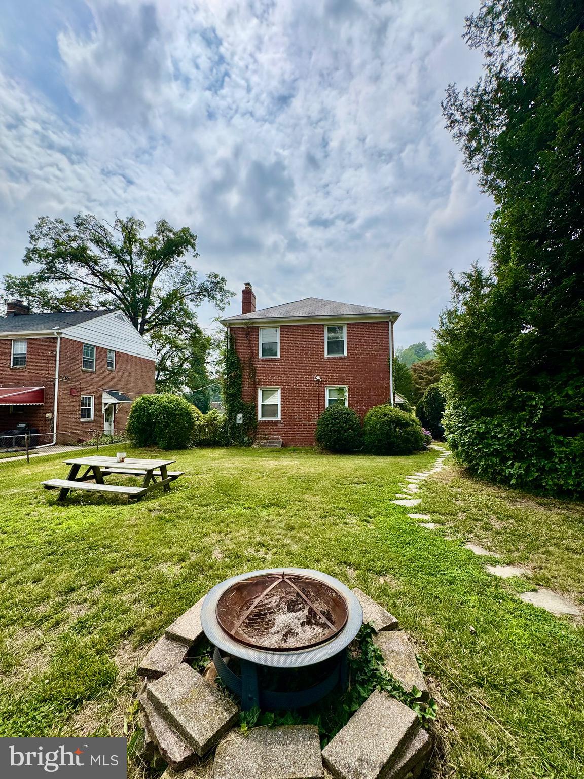 3913 Loch Raven Boulevard Baltimore, MD 21218 - Photo 26 of 38 a view of a white house with a swimming pool and a yard