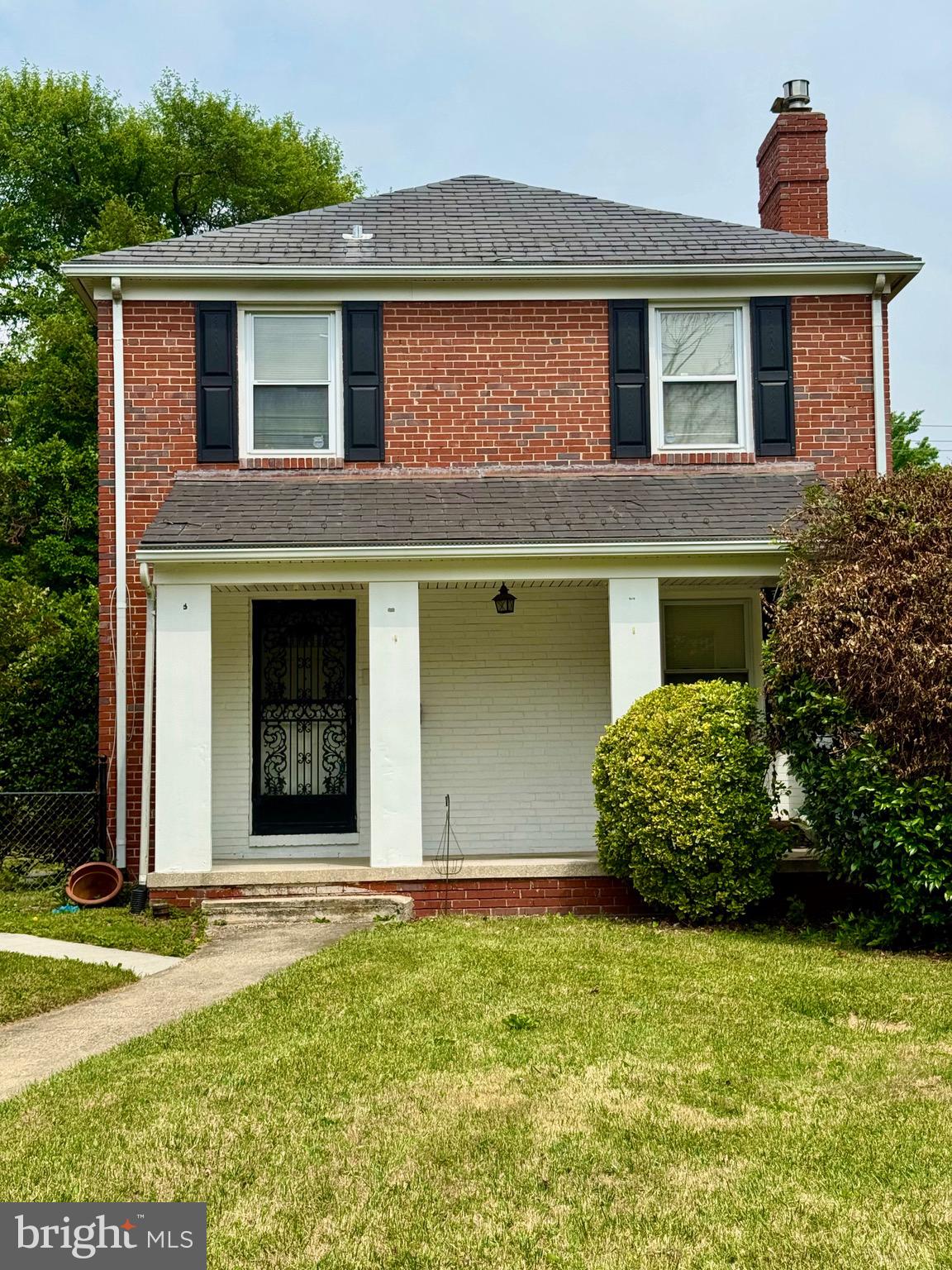 3913 Loch Raven Boulevard Baltimore, MD 21218 - Photo 3 of 38 a front view of a house with garden