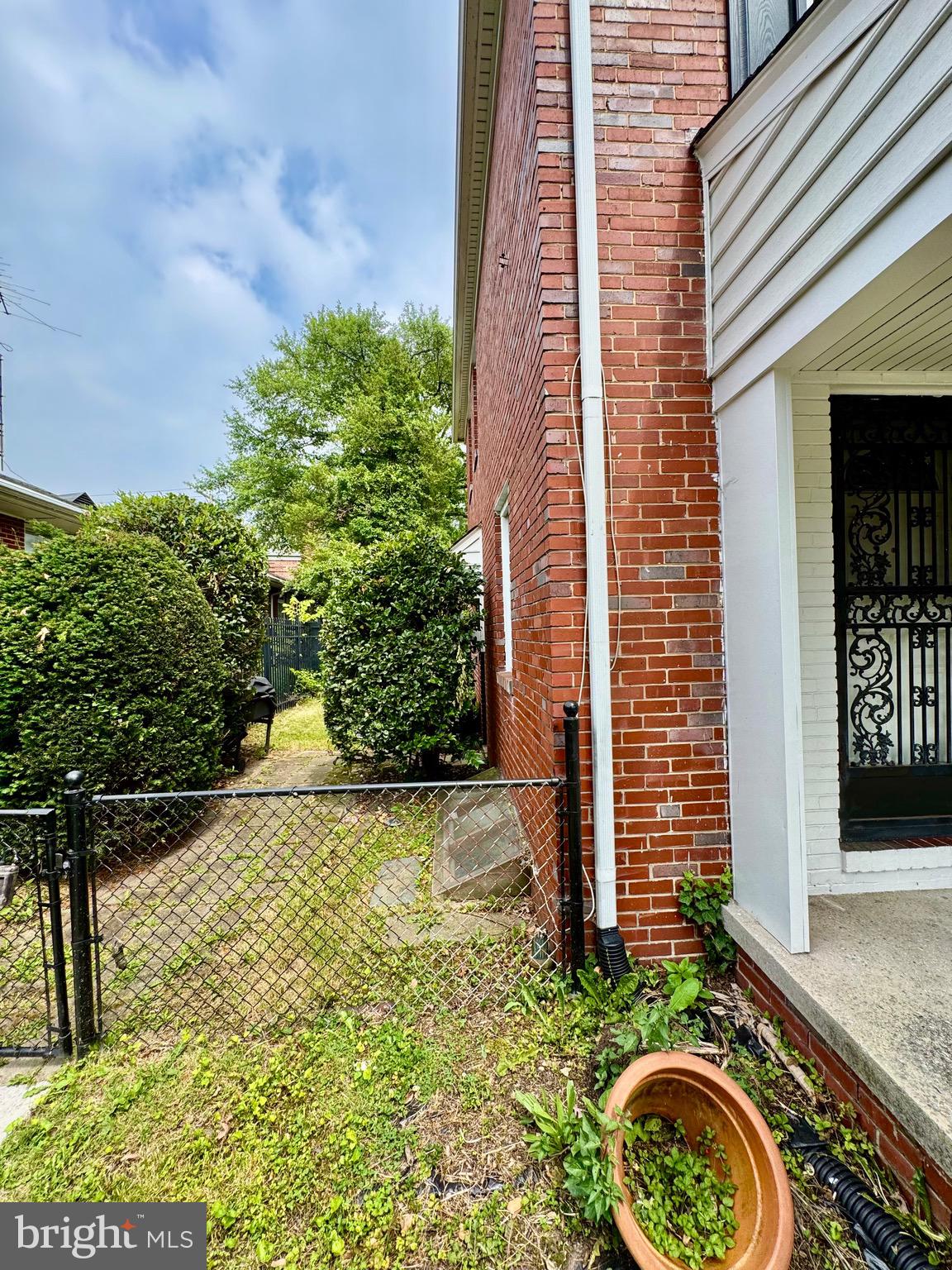 3913 Loch Raven Boulevard Baltimore, MD 21218 - Photo 38 of 38 a view of a house with a small yard and plants