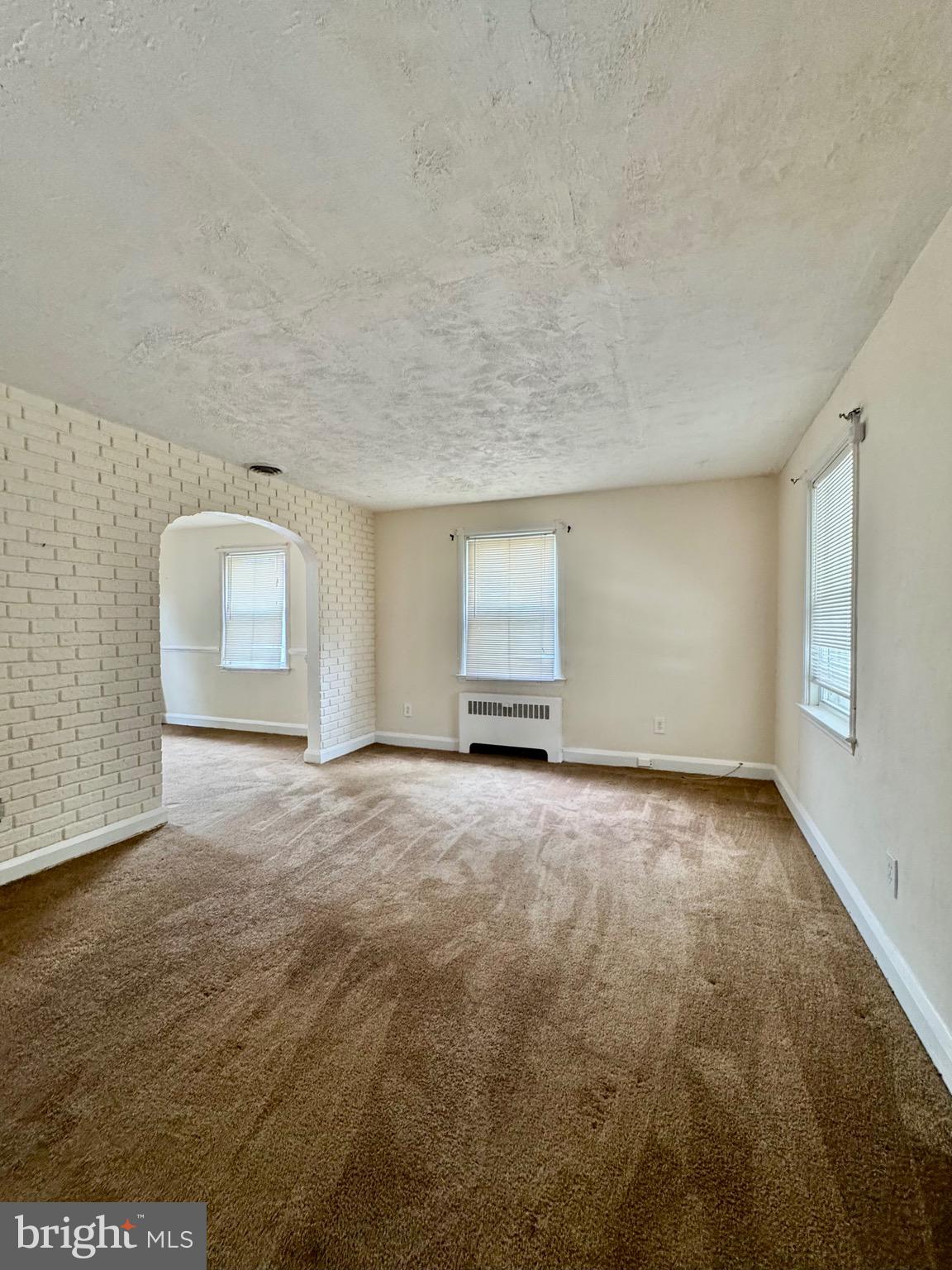 3913 Loch Raven Boulevard Baltimore, MD 21218 - Photo 5 of 38 a view of an empty room and window