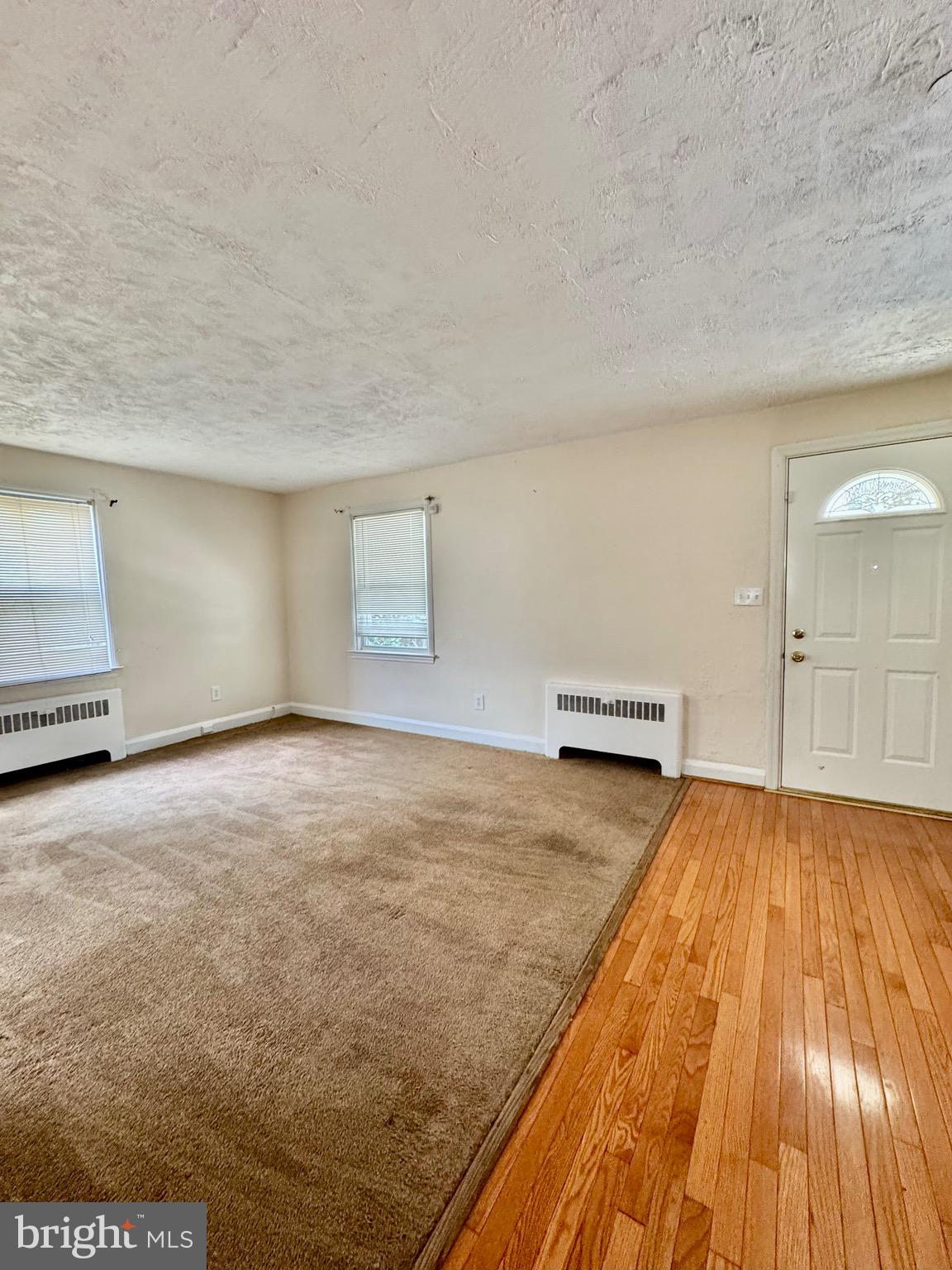 3913 Loch Raven Boulevard Baltimore, MD 21218 - Photo 6 of 38 a view of empty room with wooden floor