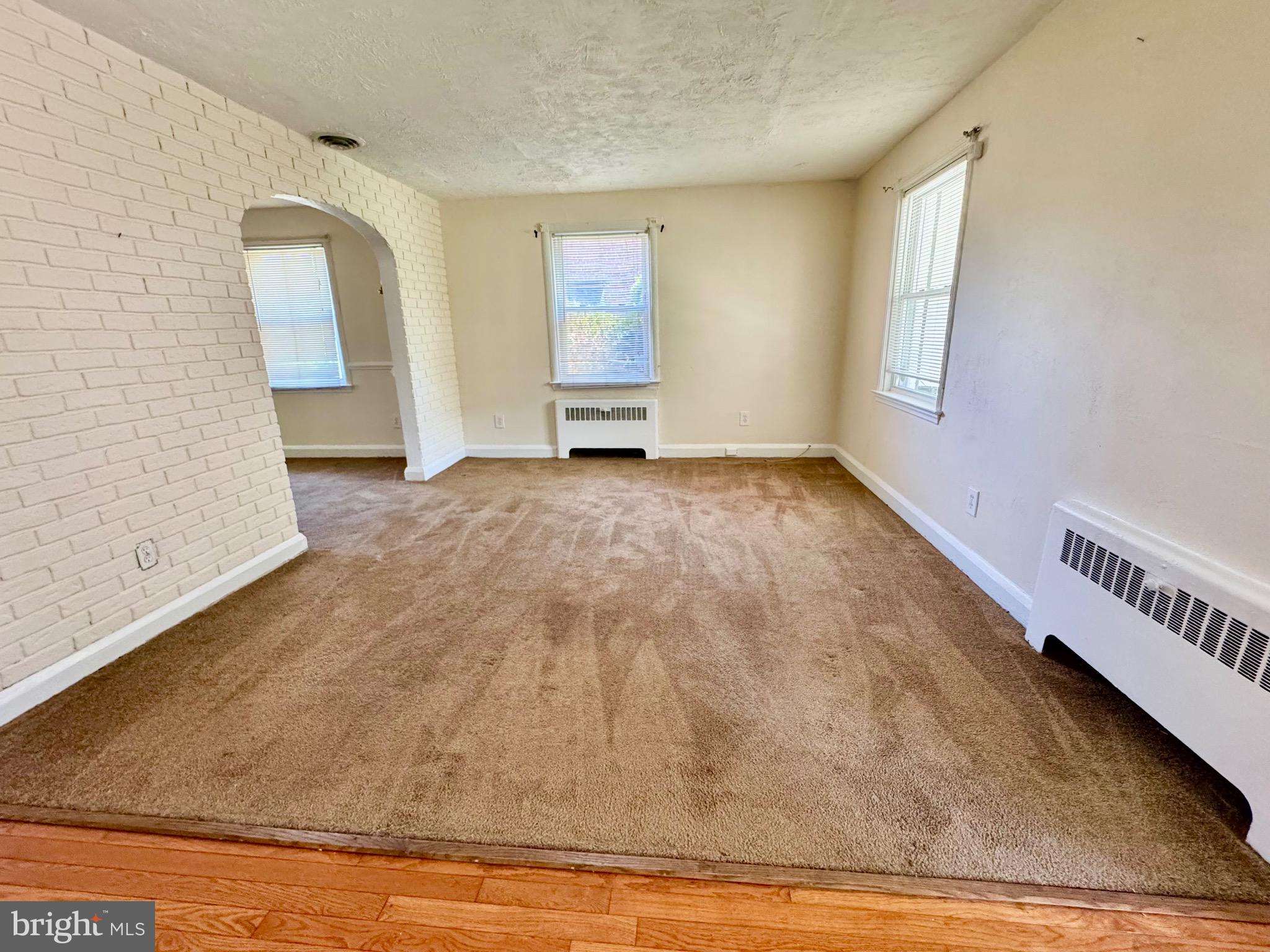 3913 Loch Raven Boulevard Baltimore, MD 21218 - Photo 7 of 38 a view of an empty room and window