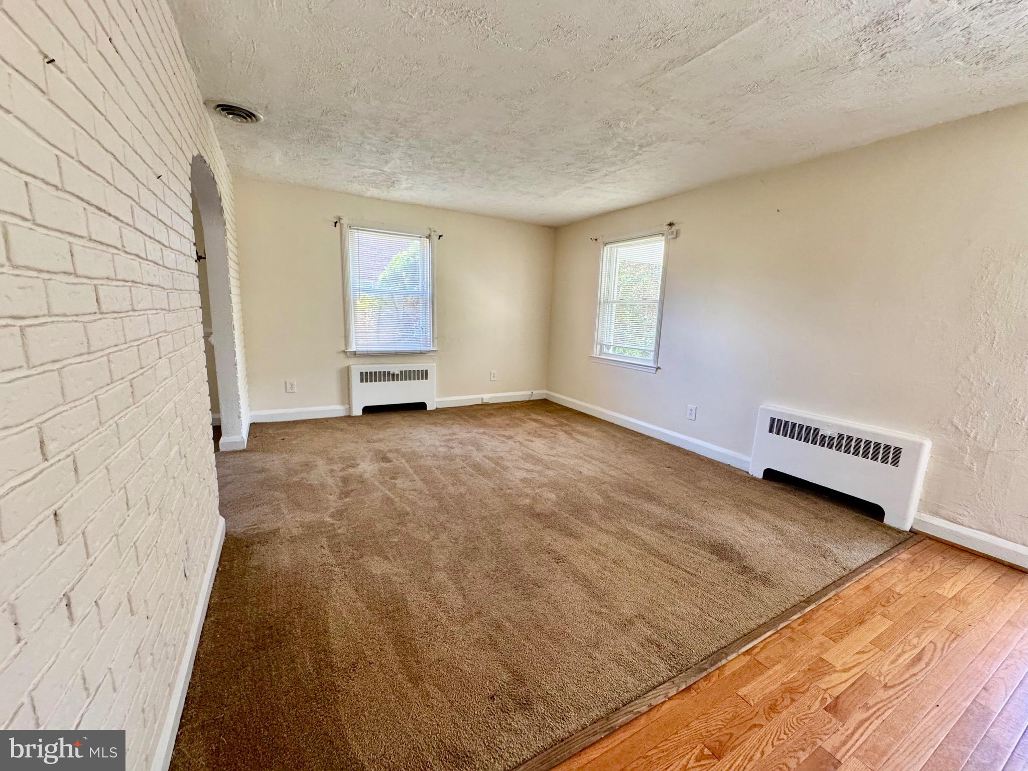 3913 Loch Raven Boulevard Baltimore, MD 21218 - Photo 8 of 38 a view of an empty room and window