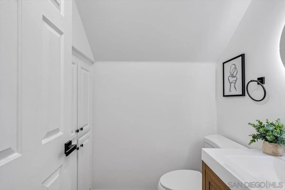 12865 Carriage Heights Way Poway, CA 92064 - Photo 15 of 42 a bathroom with a toilet and a mirror