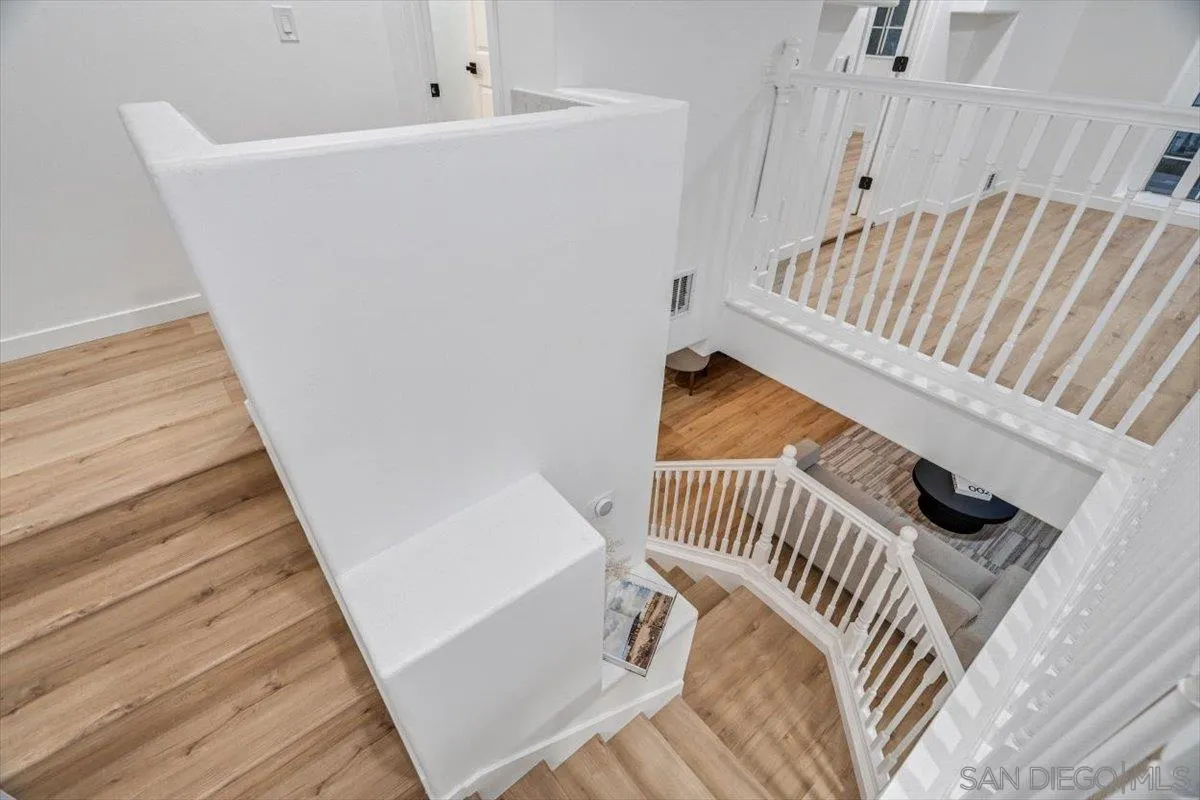 12865 Carriage Heights Way Poway, CA 92064 - Photo 20 of 42 a view of a staircase with white walls