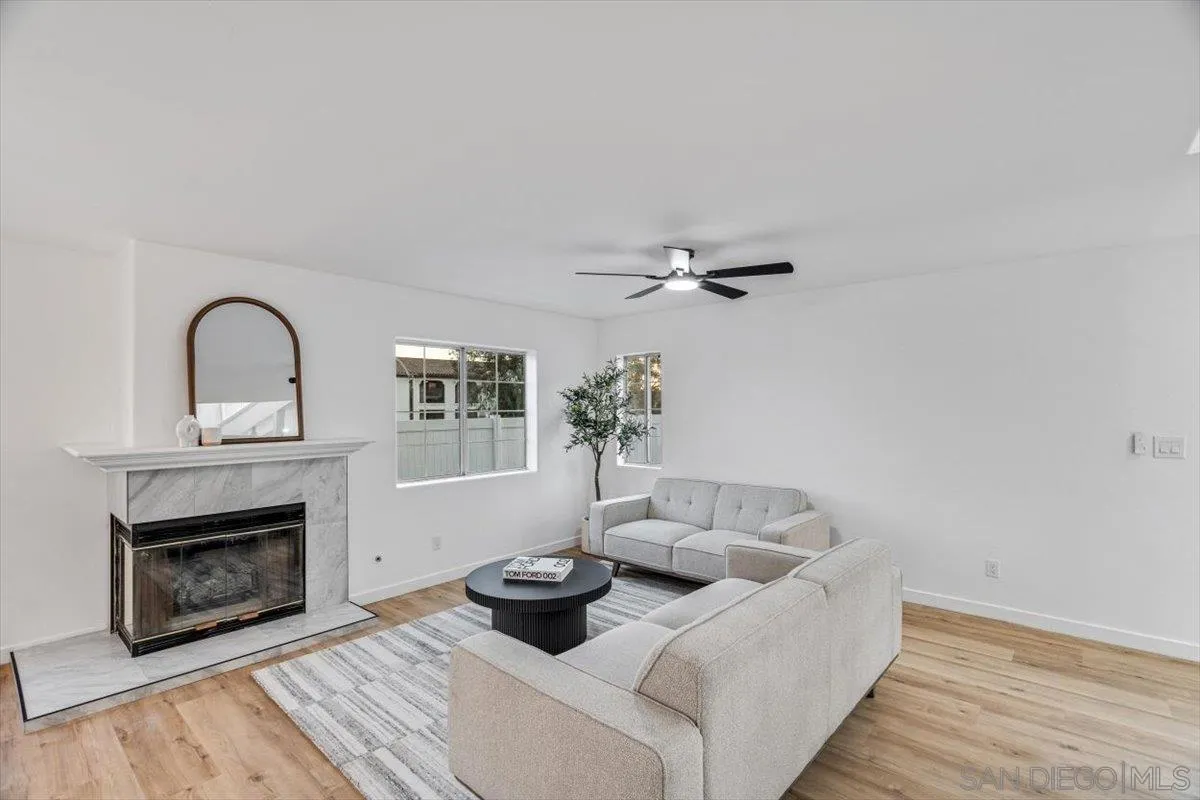 12865 Carriage Heights Way Poway, CA 92064 - Photo 8 of 42 a living room with furniture and a fireplace