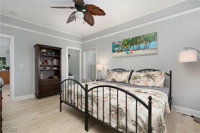 a view of a hallway with wooden floor and furniture