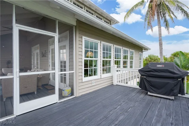a view of backyard with deck and wooden floor