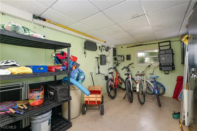 a storage room with a refrigerator and a table