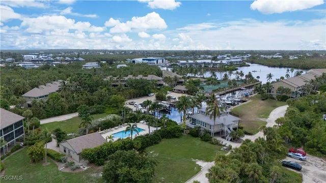 an aerial view of city and lake