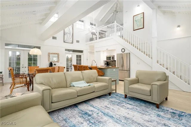 a living room with furniture and white walls