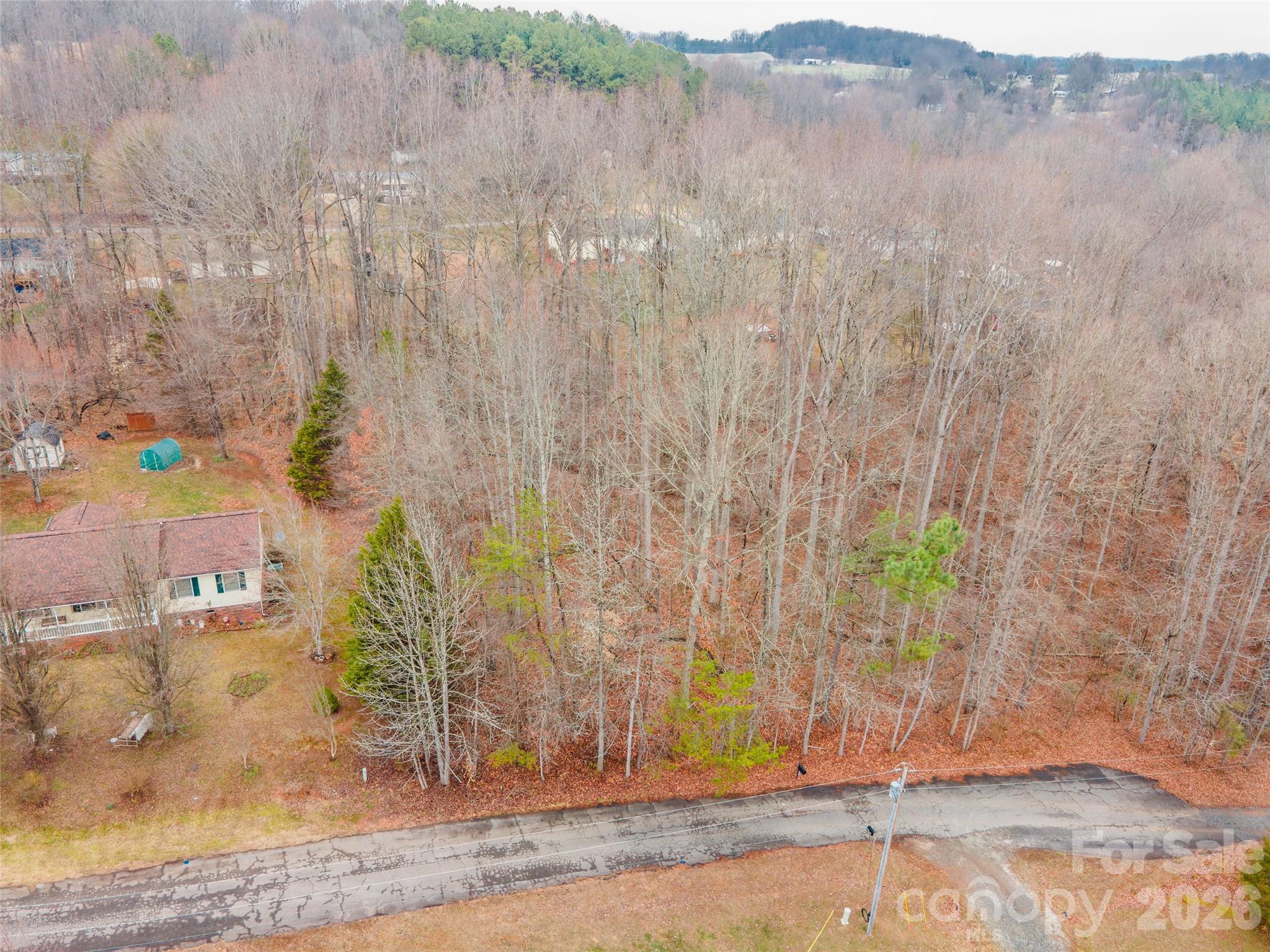 139 River Bank Road Statesville, NC 28625 - Photo 1 of 4 a view of a yard with trees