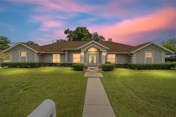 a front view of a house with yard
