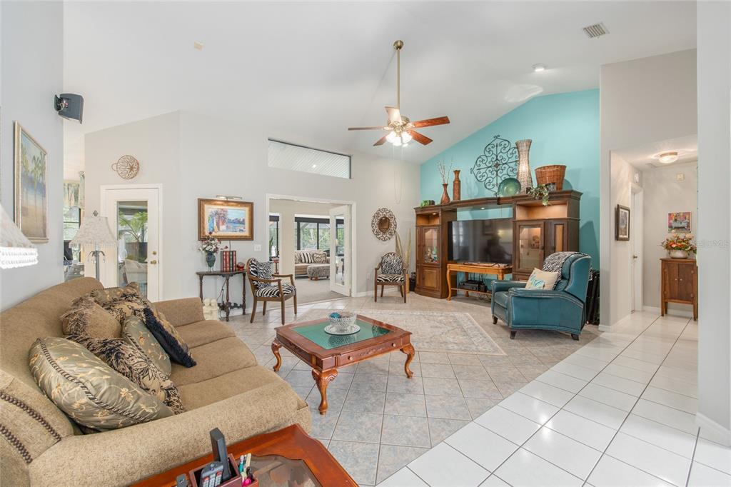 2305 Southeast 30th Street Ocala, FL 34471 - Photo 11 of 66 a living room with furniture and a chandelier