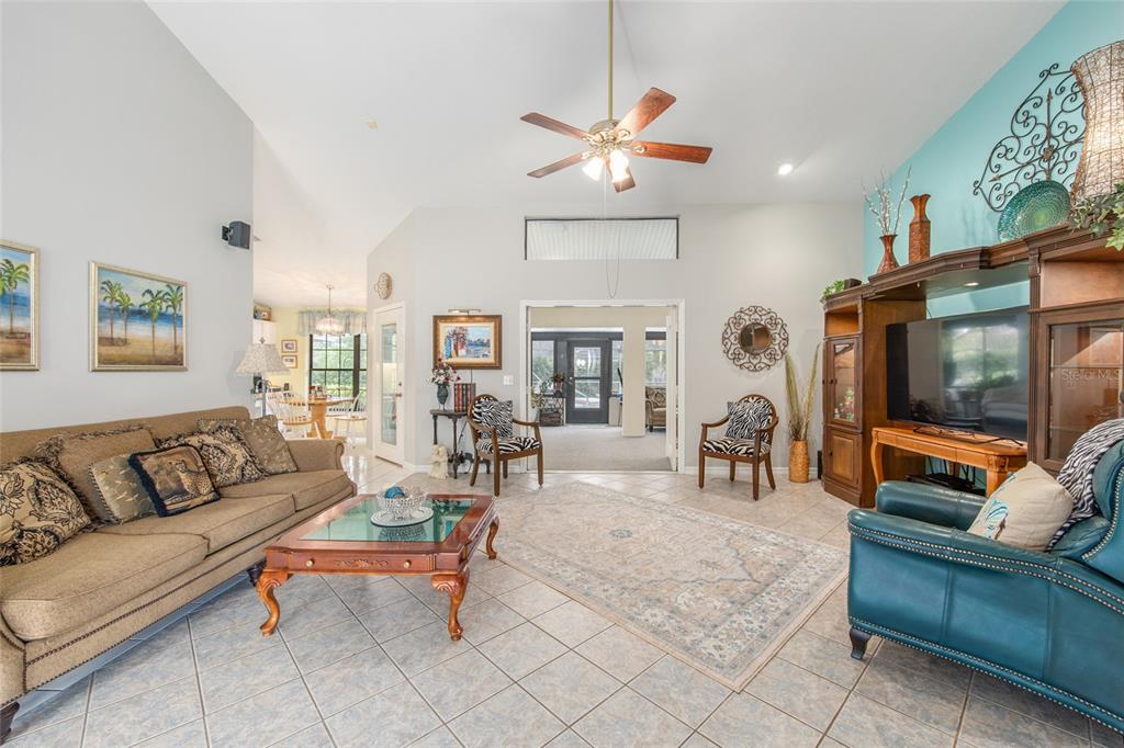 2305 Southeast 30th Street Ocala, FL 34471 - Photo 12 of 66 a living room with furniture and a flat screen tv