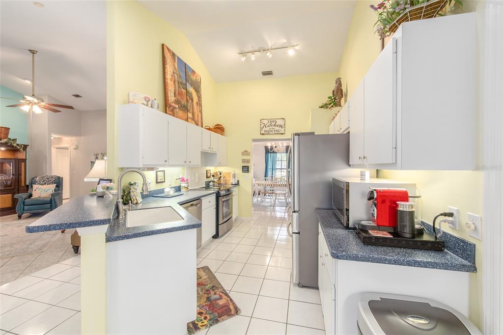 2305 Southeast 30th Street Ocala, FL 34471 - Photo 20 of 66 a kitchen with cabinets and appliances