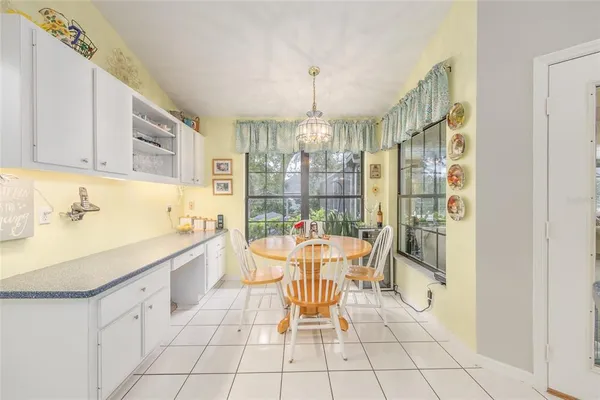 a bedroom with furniture and a chandelier