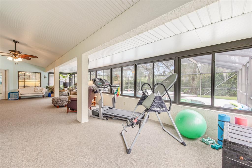 2305 Southeast 30th Street Ocala, FL 34471 - Photo 27 of 66 a room with gym equipment and large windows