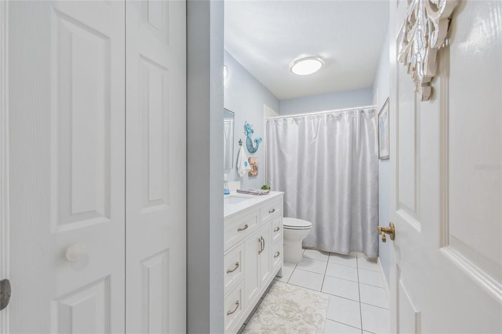 2305 Southeast 30th Street Ocala, FL 34471 - Photo 39 of 66 a bathroom with a double vanity sink and shower