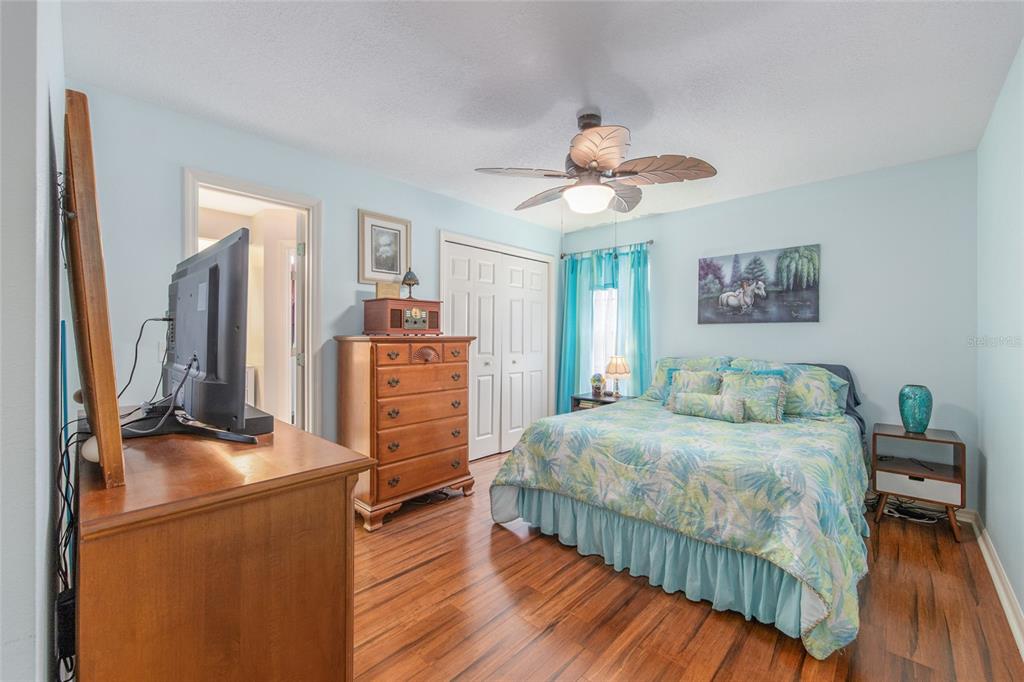 2305 Southeast 30th Street Ocala, FL 34471 - Photo 41 of 66 a bedroom with a bed and wooden floor