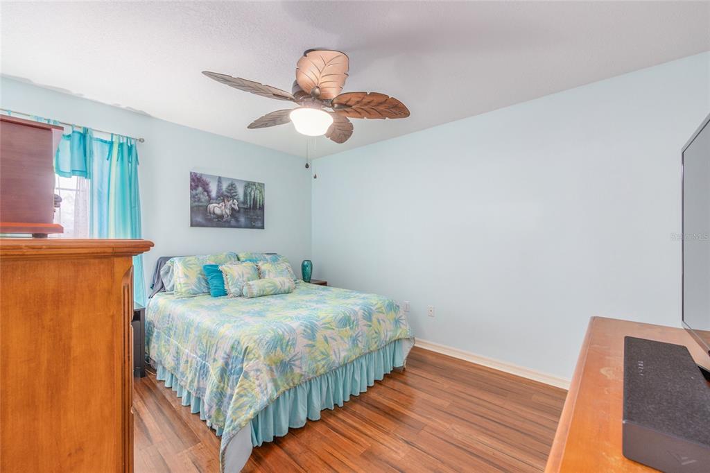 2305 Southeast 30th Street Ocala, FL 34471 - Photo 43 of 66 a bedroom with a bed and wooden floor