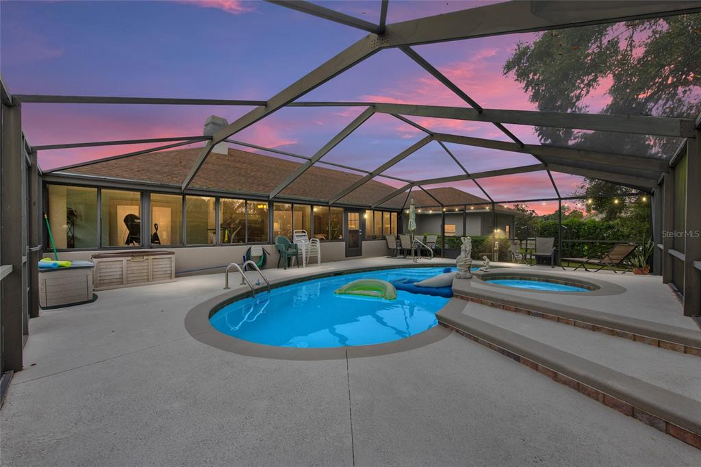 2305 Southeast 30th Street Ocala, FL 34471 - Photo 51 of 66 a view of pool with a table and chairs under an umbrella