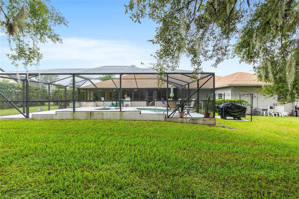 2305 Southeast 30th Street Ocala, FL 34471 - Photo 58 of 66 a view of a swimming pool and lounge chairs in the patio