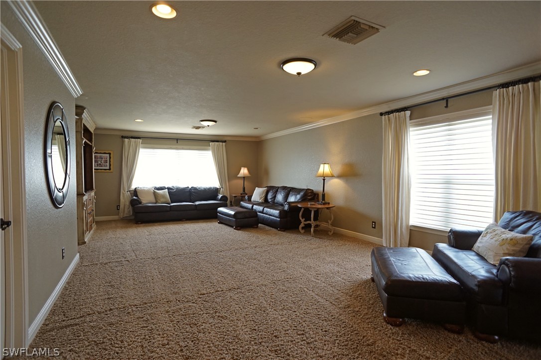 12439 Rock Ridge Lane Fort Myers, FL 33913 - Photo 23 of 35 a living room with furniture and a window