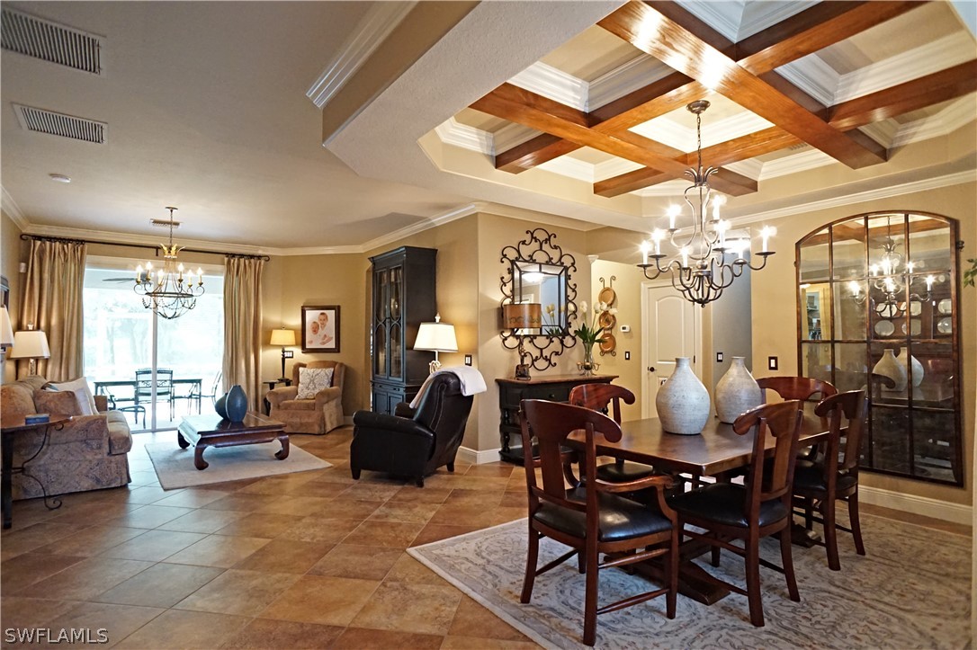 12439 Rock Ridge Lane Fort Myers, FL 33913 - Photo 3 of 35 a view of a dining room with furniture and chandelier