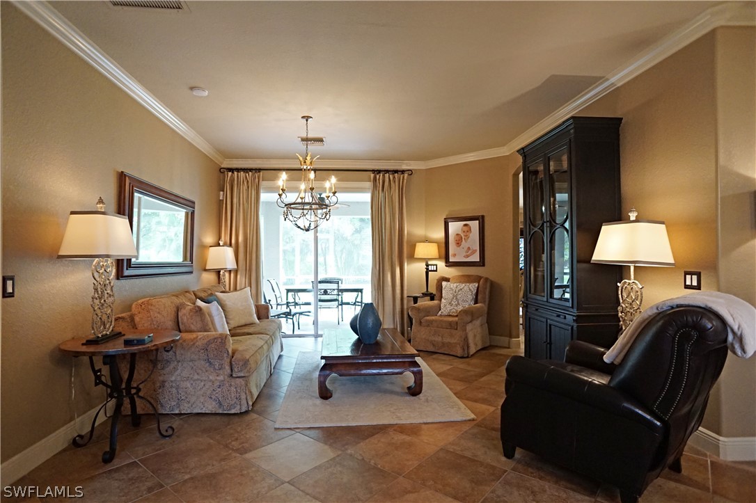 12439 Rock Ridge Lane Fort Myers, FL 33913 - Photo 5 of 35 a living room with furniture and a lamp
