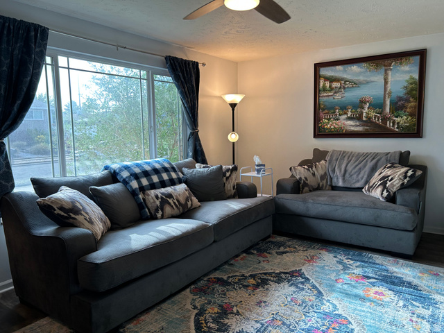 7659 State Street Midvale, UT 84047 - Photo 2 of 33 Living room featuring wood finished floors, a ceiling fan, and a textured ceiling