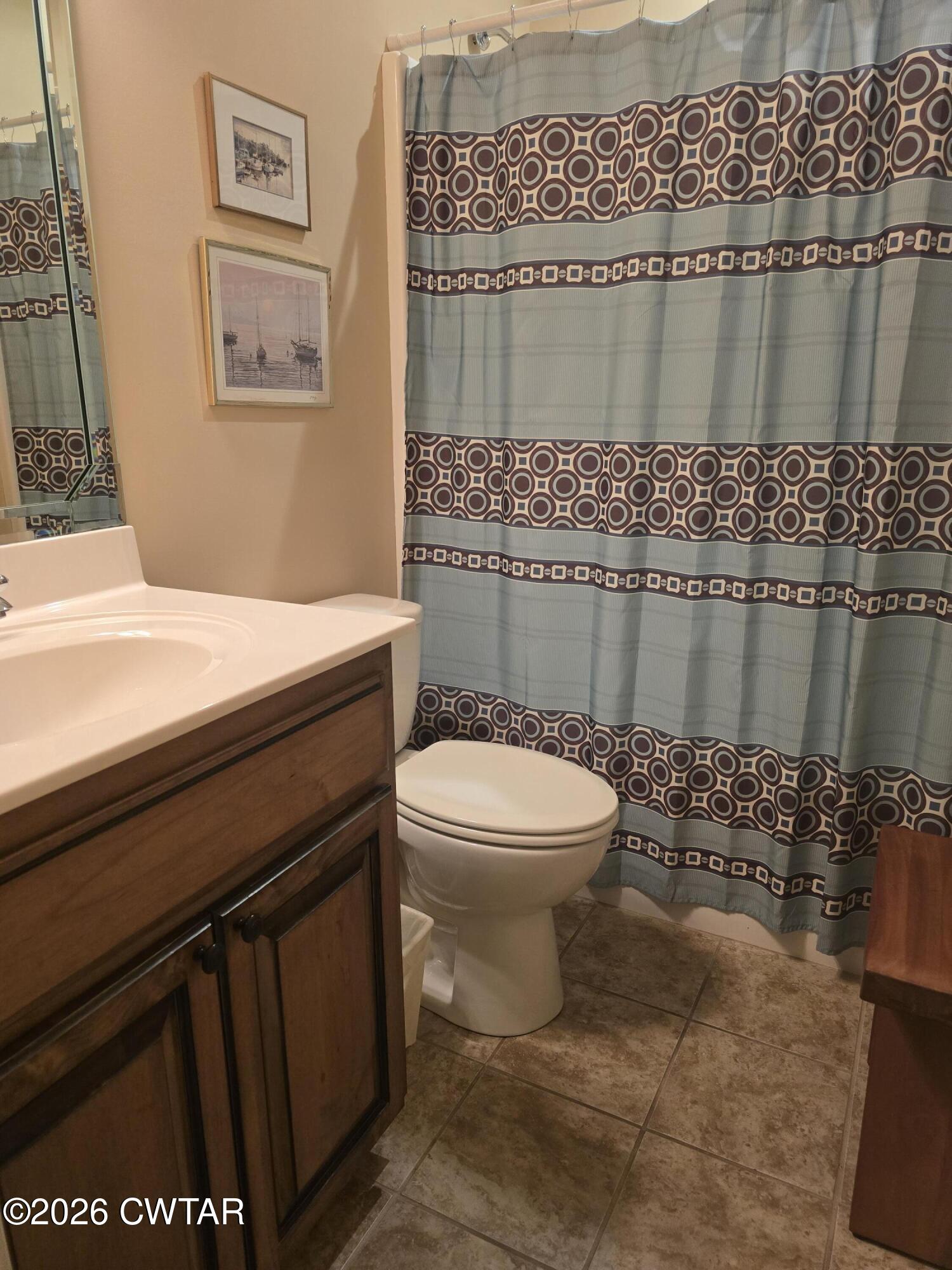 61 Emerald Ridge Cove Jackson, TN 38305 - Photo 13 of 24 a bathroom with a toilet a sink and shower