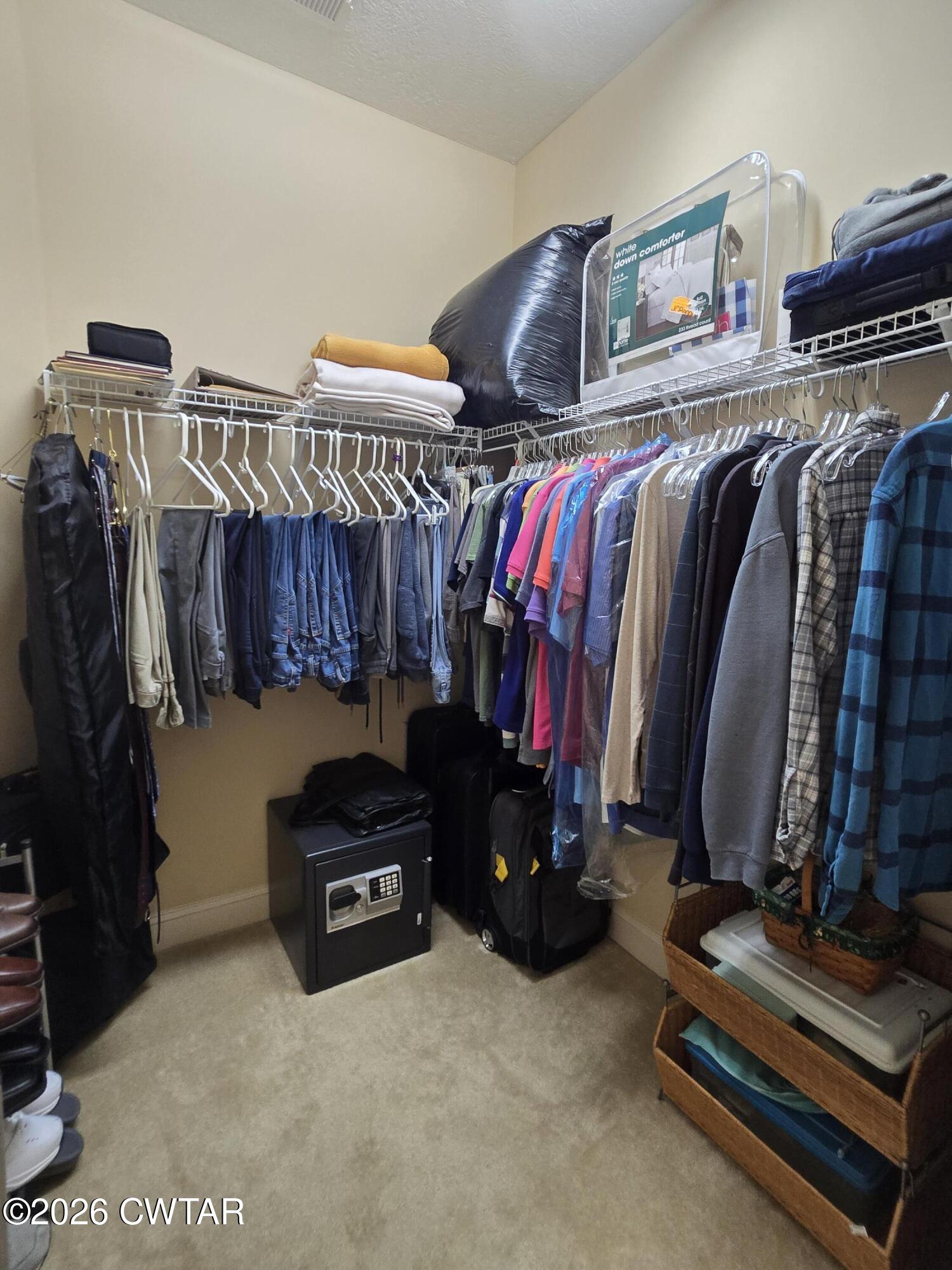 61 Emerald Ridge Cove Jackson, TN 38305 - Photo 17 of 24 a view of walk in closet with clothes and shoes