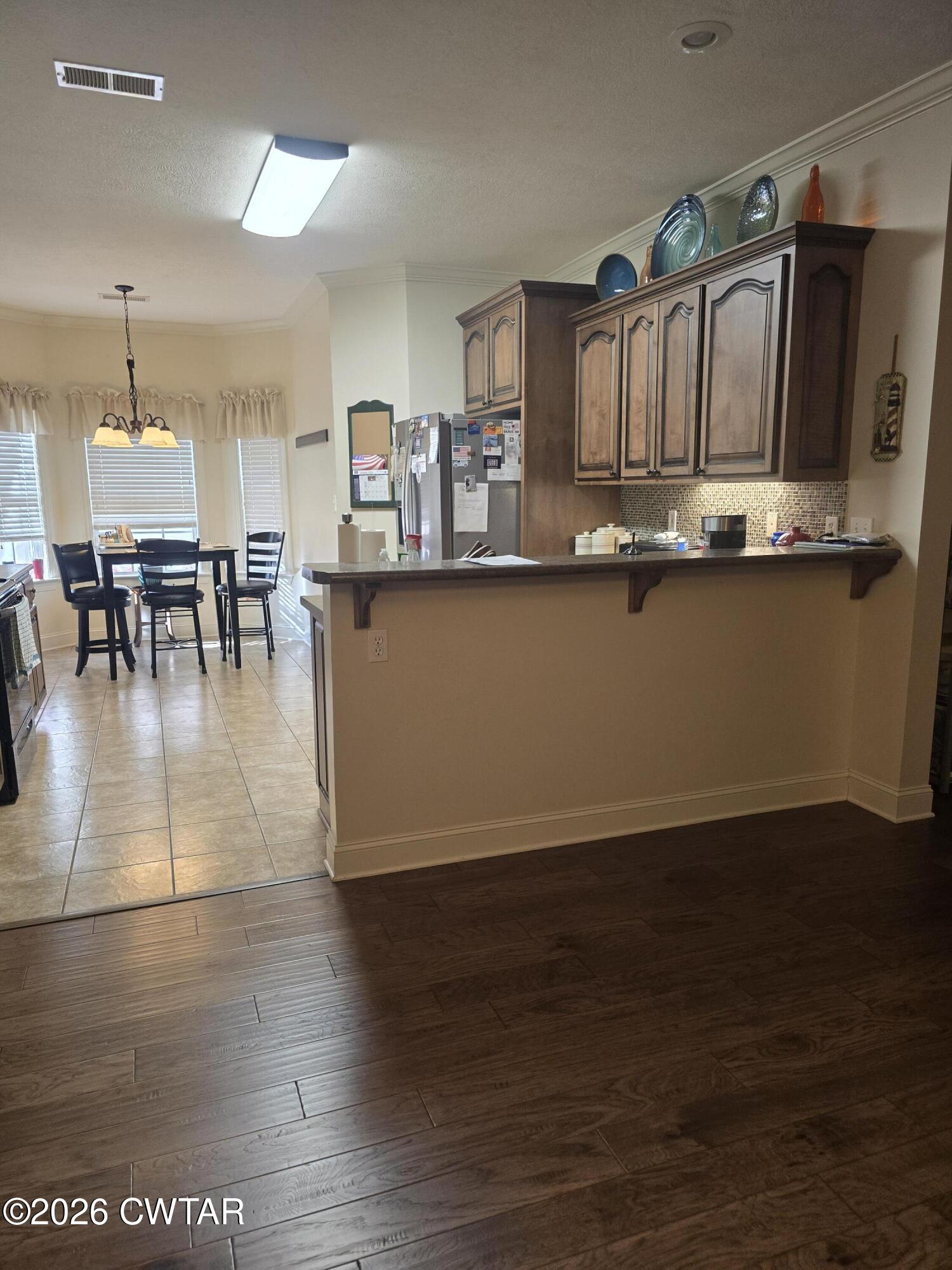 61 Emerald Ridge Cove Jackson, TN 38305 - Photo 4 of 24 a view of kitchen with furniture and wooden floor