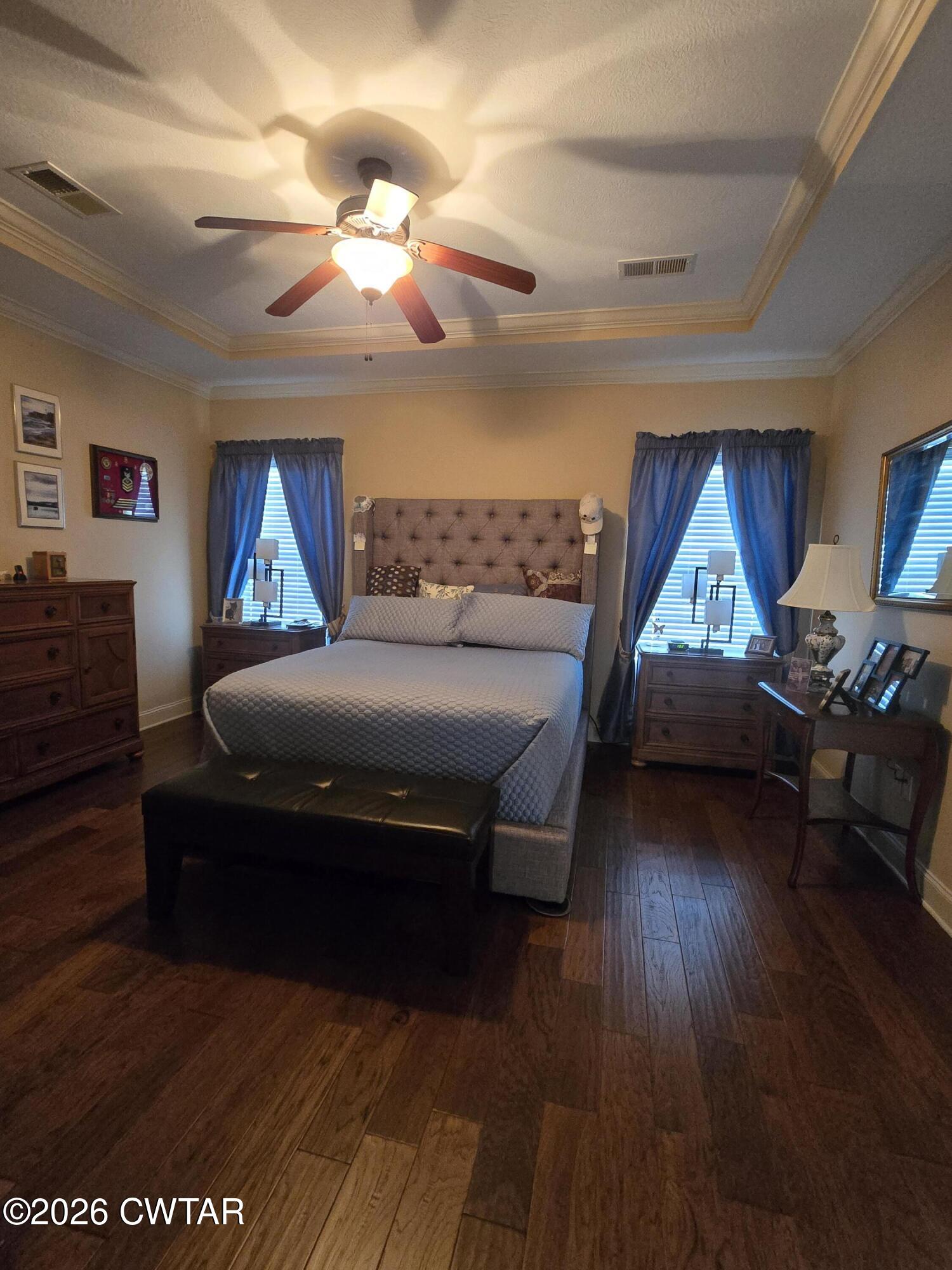 61 Emerald Ridge Cove Jackson, TN 38305 - Photo 9 of 24 a bedroom with a bed and wooden floor