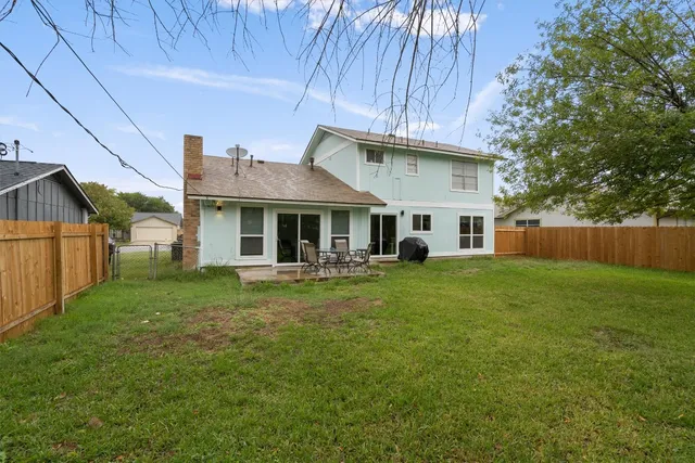 a front view of a house with a garden and porch