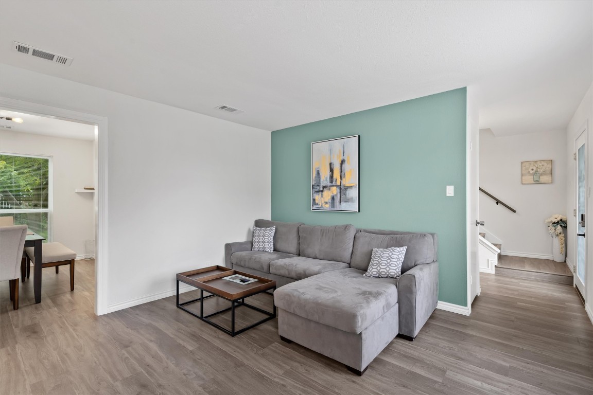 405 East Logan Street Round Rock, TX 78664 - Photo 4 of 23 a living room with furniture and a wooden floor