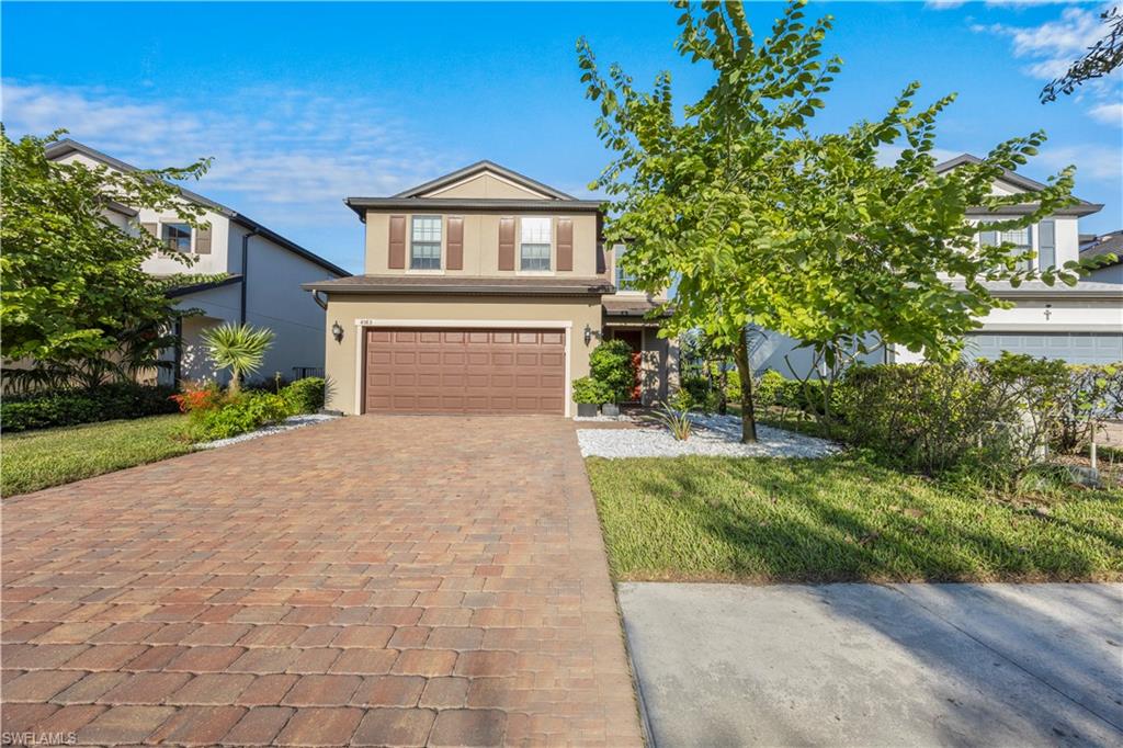 4583 Lamaida Lane Immokalee, FL 34142 - Photo 1 of 29 a front view of a house with a garden and yard