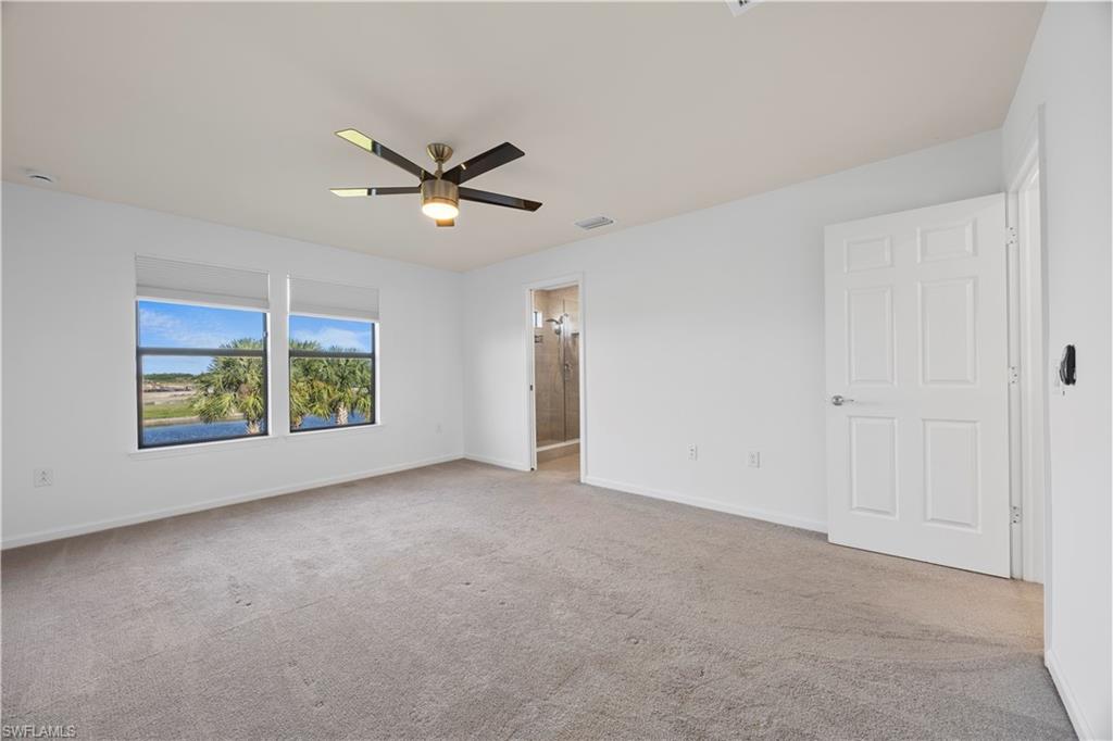 4583 Lamaida Lane Immokalee, FL 34142 - Photo 18 of 29 a view of a livingroom with a ceiling fan and window