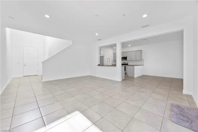 a view of a livingroom with a dishwasher and cabinets