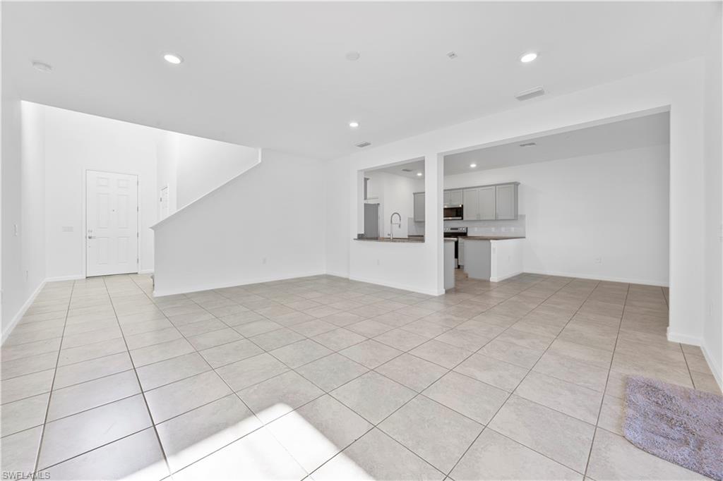 4583 Lamaida Lane Immokalee, FL 34142 - Photo 7 of 29 a view of a livingroom with a dishwasher and cabinets