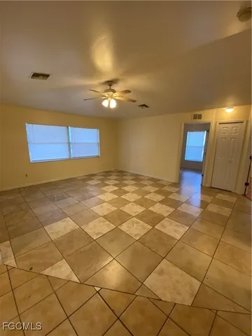 a view of a livingroom with a furniture and lamp