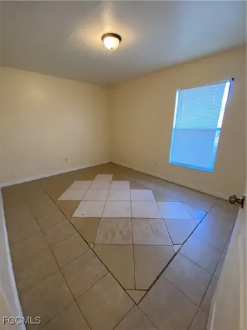 an empty room with a bench