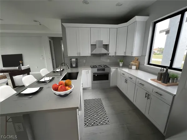 a kitchen with lots of appliances and a sink