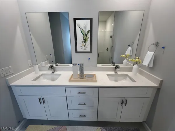 a bathroom with a sink and a mirror